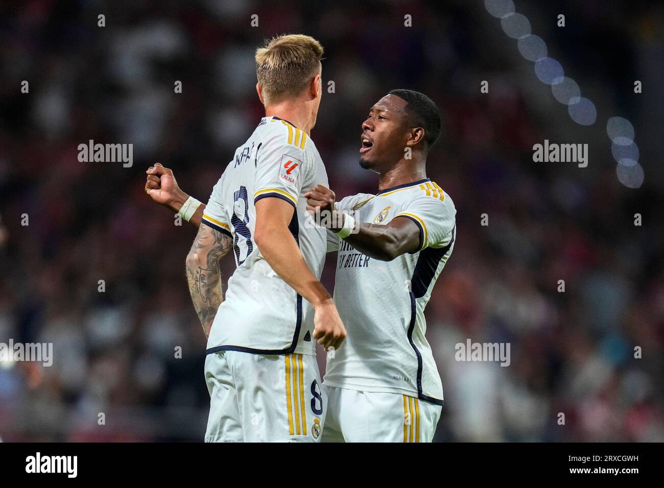 Real Madrid's Toni Kroos, left, celebrates with teammate David Alaba after  scoring his side's first goal during the Spanish La Liga soccer match  between Atletico Madrid and Real Madrid at Metropolitan stadium