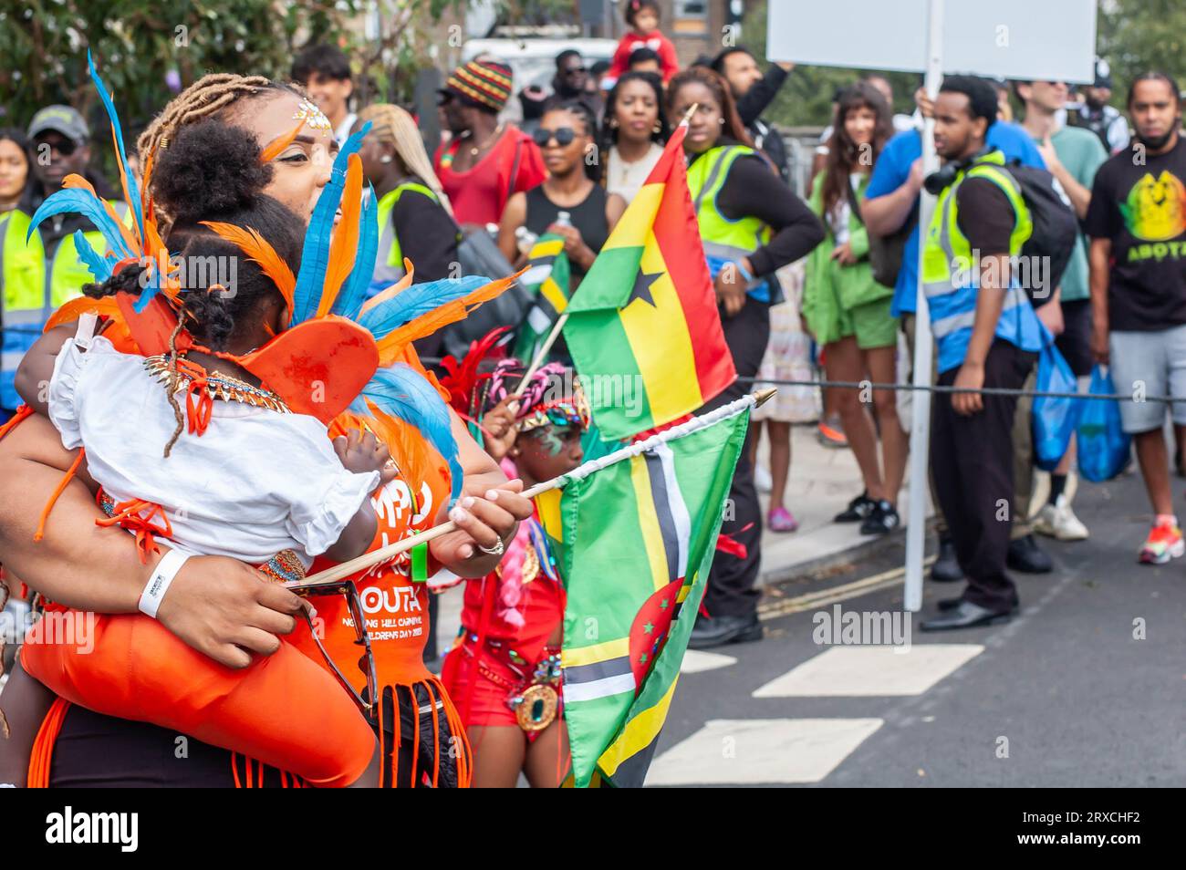 NOTTING HILL, LONDON, ENGLAND - 27 August 2023: Child wearing a costume at the children's day parade at Notting Hill Carnival 2023 Stock Photo