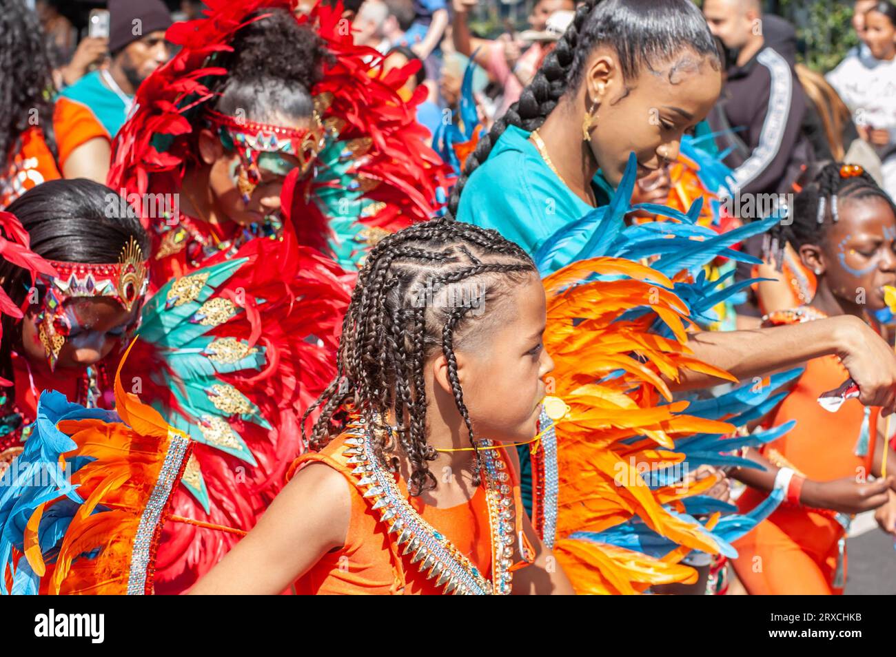 NOTTING HILL, LONDON, ENGLAND - 27 August 2023: Child wearing a costume at the children's day parade at Notting Hill Carnival 2023 Stock Photo