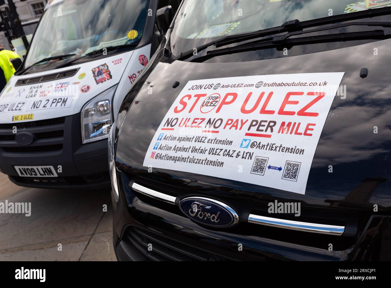 Vans parked in Trafalgar Square at a protest against the Ultra Low Emission Zone environmental scheme in London, UK. Stop ULEZ signs Stock Photo