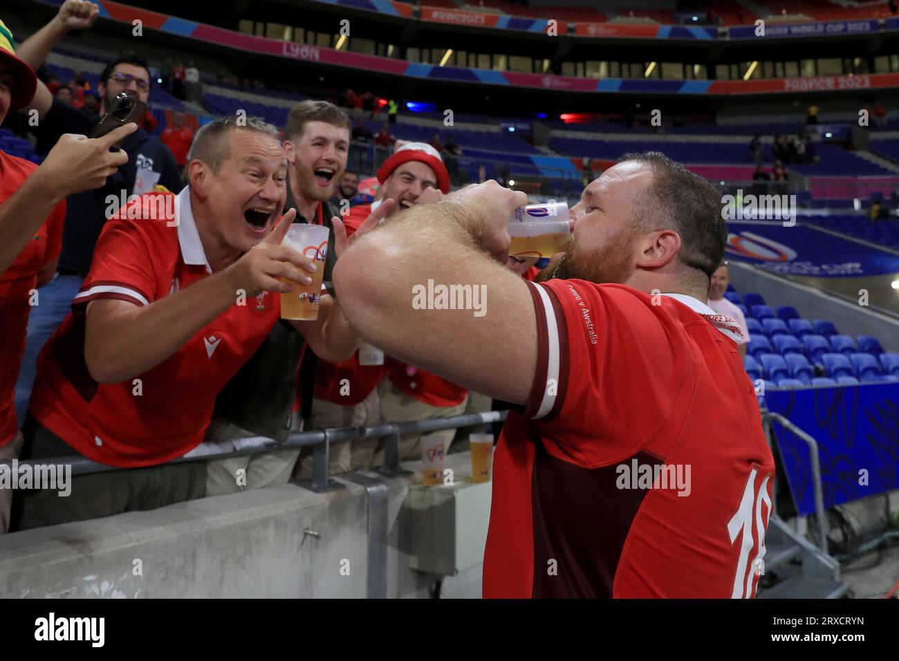 Wales' Henry Thomas interacts with by drinking a pint of beer following the Rugby World Cup 2023, Pool C match at the OL Stadium in Lyon, France. Picture date: Sunday September 24, 2023. Stock Photo