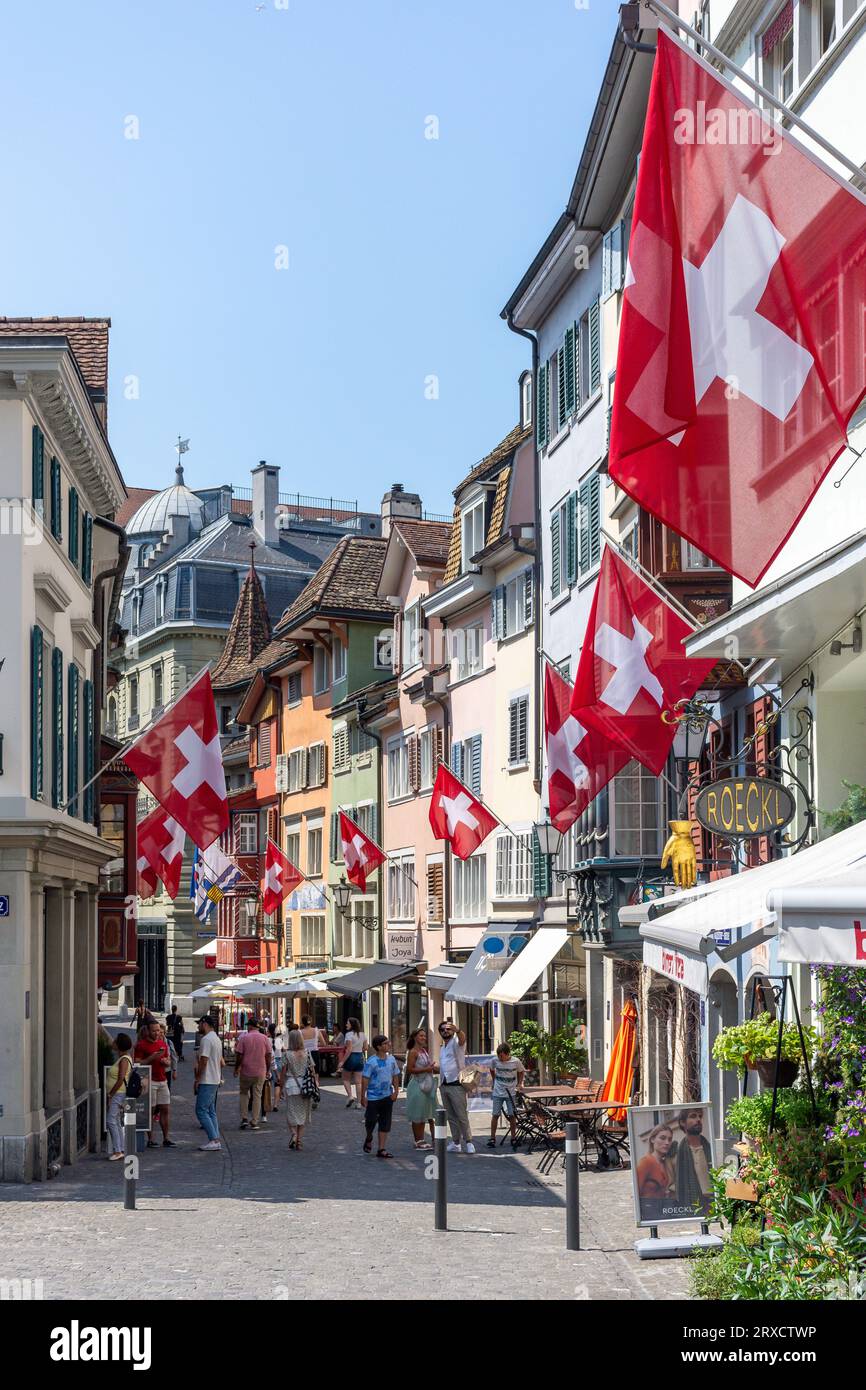 Pedestrianised street with Swiss flags, Augustinergasse, City of Zürich, Zürich, Switzerland Stock Photo