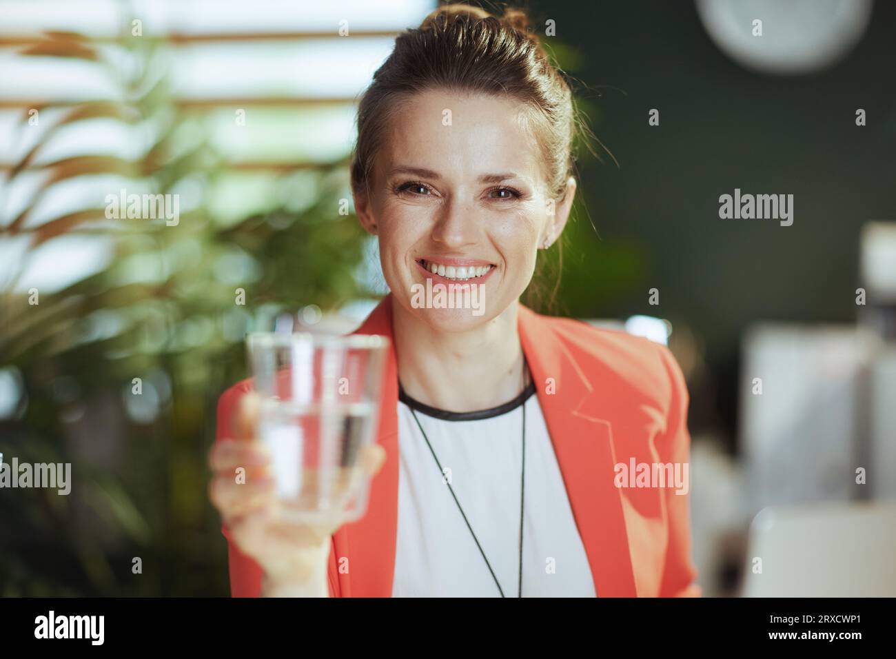 Sustainable workplace. happy modern small business owner woman at work