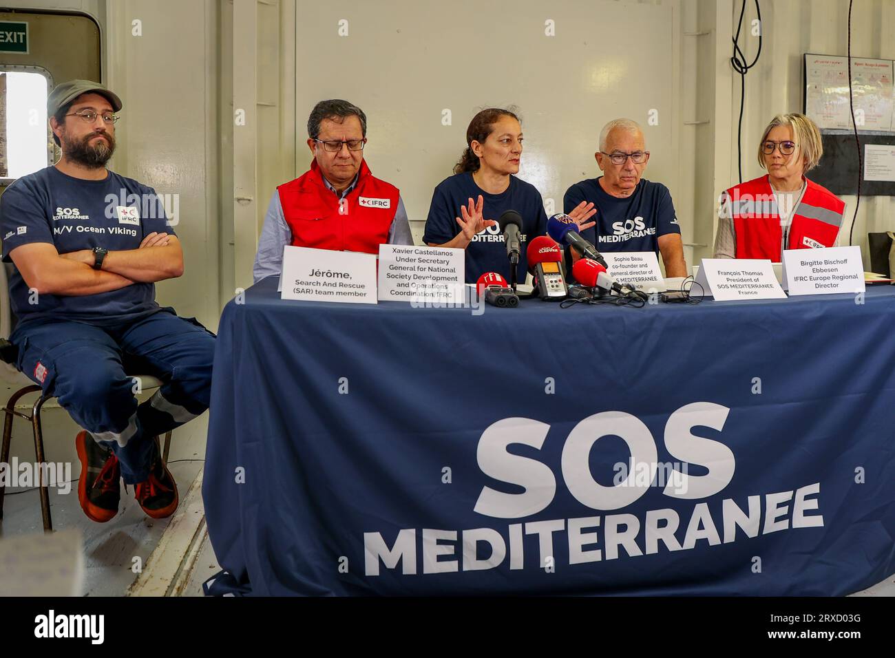 From L to R : Jérome search and rescue team member, Xavier CASTELLANOS, Sophie BEAU, François THOMAS, Brigitte BISCHOFF EBBESEN, answer questions from journalists during the press conference aboard the humanitarian ship Viking Ocean The NGO SOS Méditerranée and its partner the IFRC (International Federation of the Red Cross) have launched an appeal for solidarity from European states who bear witness to the deterioration of people in distress in the central Mediterranean. Stock Photo