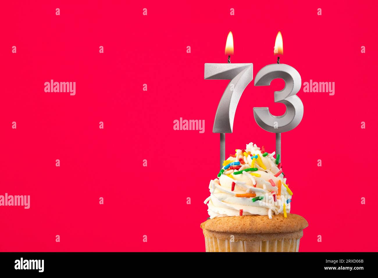 Horizontal birthday card with cake - Burning candle number 73 Stock Photo