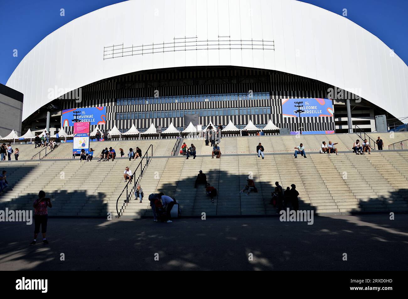 People and Rugby World Cup posters are seen at the entrance to the Orange-Velodrome Stadium. France hosts the 2023 Rugby World Cup from September 8 to October 28, 2023. The South Africa - Tonga match will take place at the Orange-Vélodrome stadium in Marseille on October 1, 2023. Stock Photo