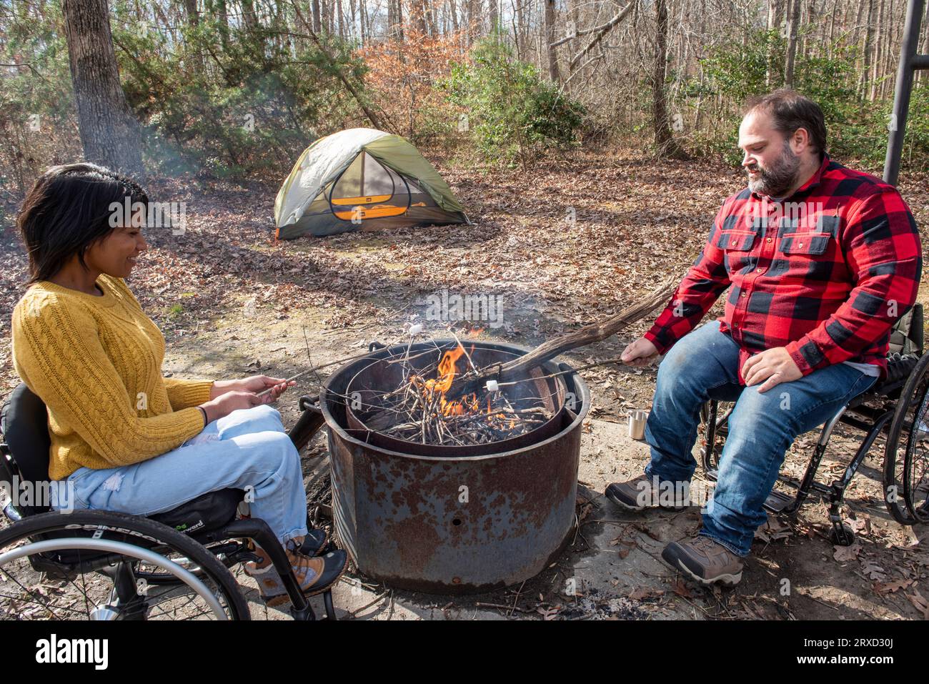 Roasting s'mores over a campfire is fun for all ages. Stock Photo
