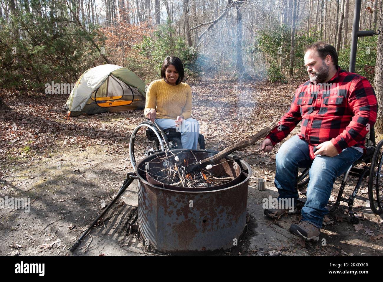Roasting s'mores over a campfire is fun for all ages. Stock Photo