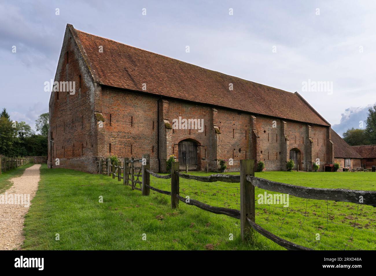The 16th Century Tudor Great Barn. Built from over a million bricks and tiles and survived the civil war largely intact. Old Basing, Basingstoke, UK Stock Photo