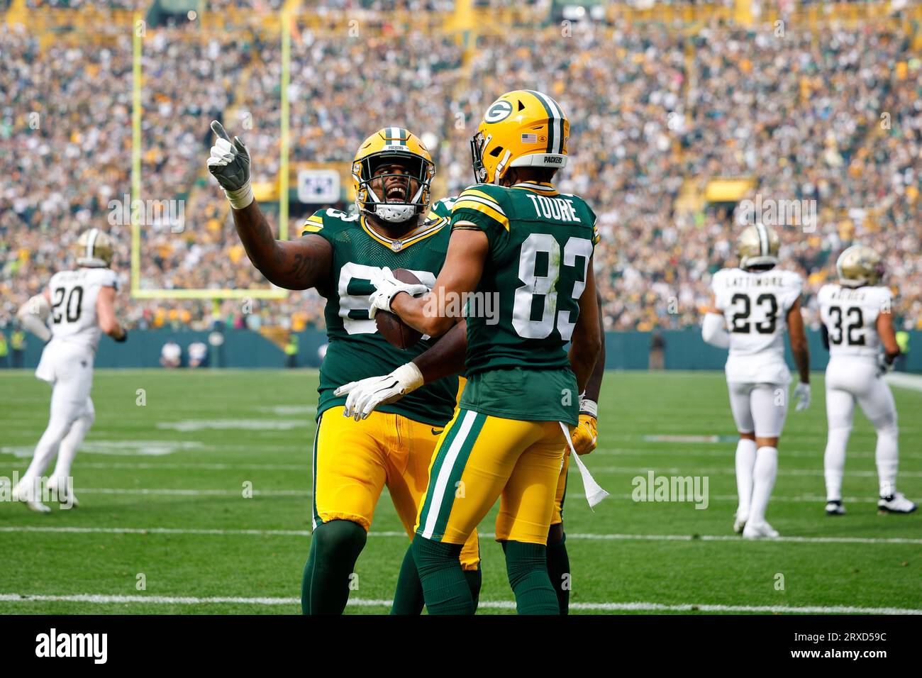 Green Bay, Wisconsin, USA. 24th Sep, 2023. Green Bay Packers offensive tackle Rasheed Walker (63) celebrates wide receiver Samori Toure (83) 2-point conversion catch during the NFL football game between the New Orleans Saints and the Green Bay Packers at Lambeau Field in Green Bay, Wisconsin. Darren Lee/CSM/Alamy Live News Stock Photo