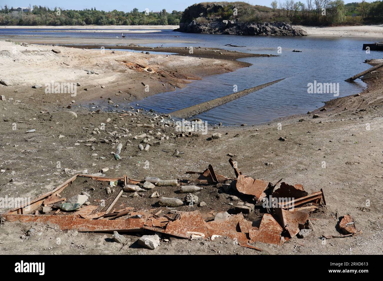 A view of the boat remains on the shoreline as water in Dnipro river dropped more than 4 meters after the explosion of the Kakhovka dam in Zaporizhzhia. The commander of the Tavria group troops, Oleksandr Tarnavskyi (Ukraine), said that the Defence Forces had broken through the Russian defences in Verbove, Zaporizhzhia region. He adds that the main thing is not to lose the initiative that the Ukrainian army has now. Stock Photo