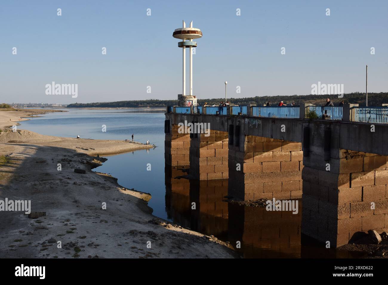 Local residents are seeing on a central pier as water in Dnipro river dropped more than 4 meters after the explosion of the Kakhovka dam in Zaporizhzhia. The commander of the Tavria group troops, Oleksandr Tarnavskyi (Ukraine), said that the Defence Forces had broken through the Russian defences in Verbove, Zaporizhzhia region. He adds that the main thing is not to lose the initiative that the Ukrainian army has now. Stock Photo
