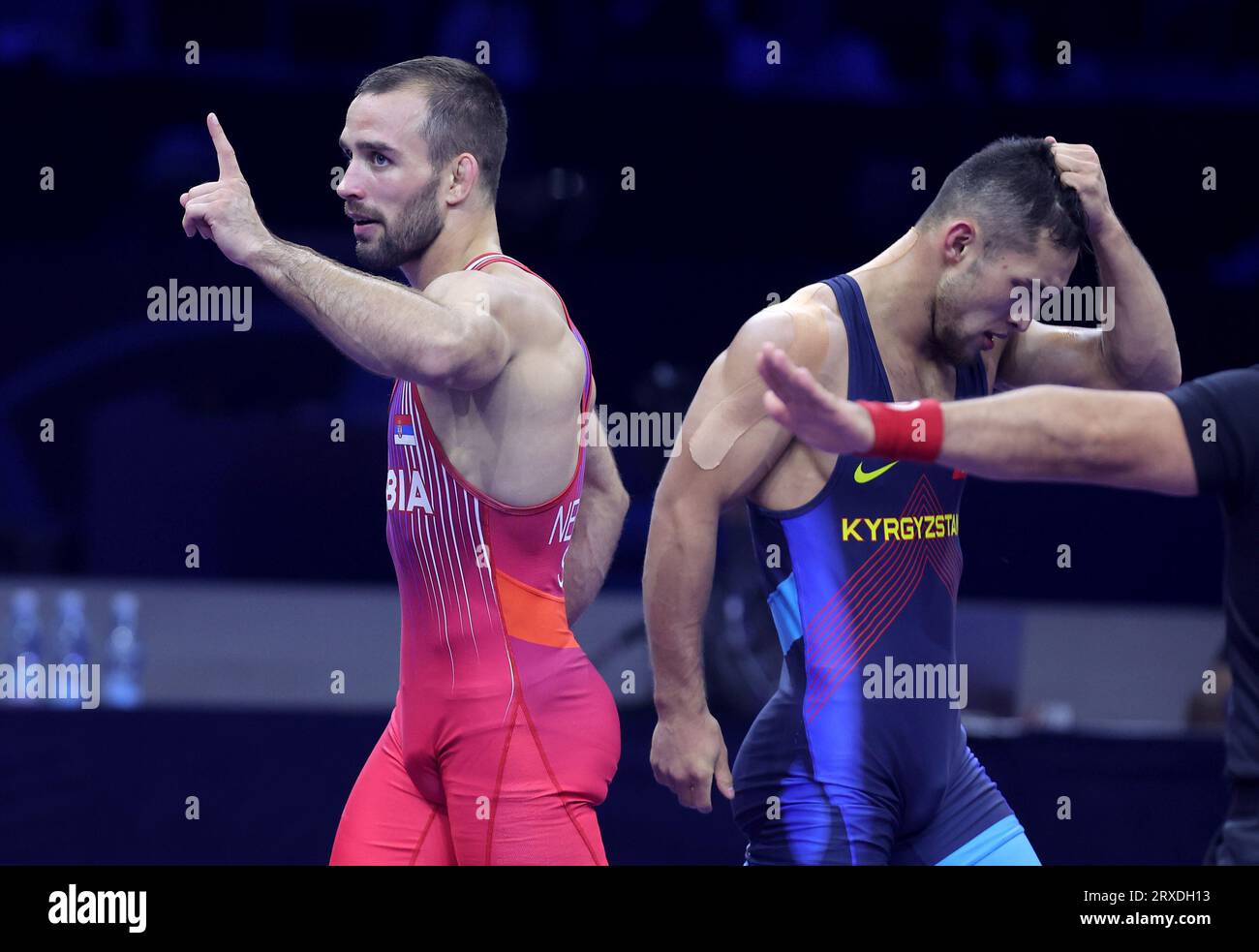 Belgrade. 24th Sep, 2023. Serbia's Mate Nemes (L) celebrate victory after defeating Kyrgyzstan's Amantur Ismailov after their match for bronze medal in the men's 67kg Greco-Roman category at the Wrestling World Championships in Belgrade, Serbia on Sept. 24, 2023. Credit: Predrag Milosavljevic/Xinhua/Alamy Live News Stock Photo