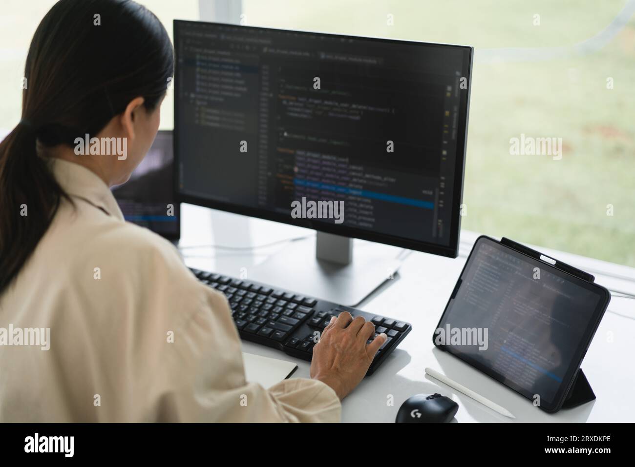 Developer programmer typing code on keyboard for programming to developing web and application. Stock Photo