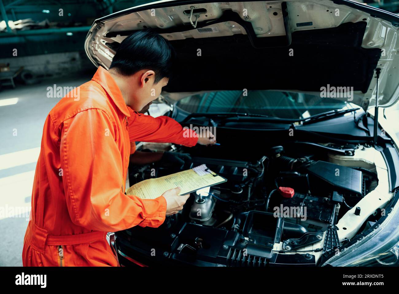 Automotive service mechanic inspect and diagnose car engine issue