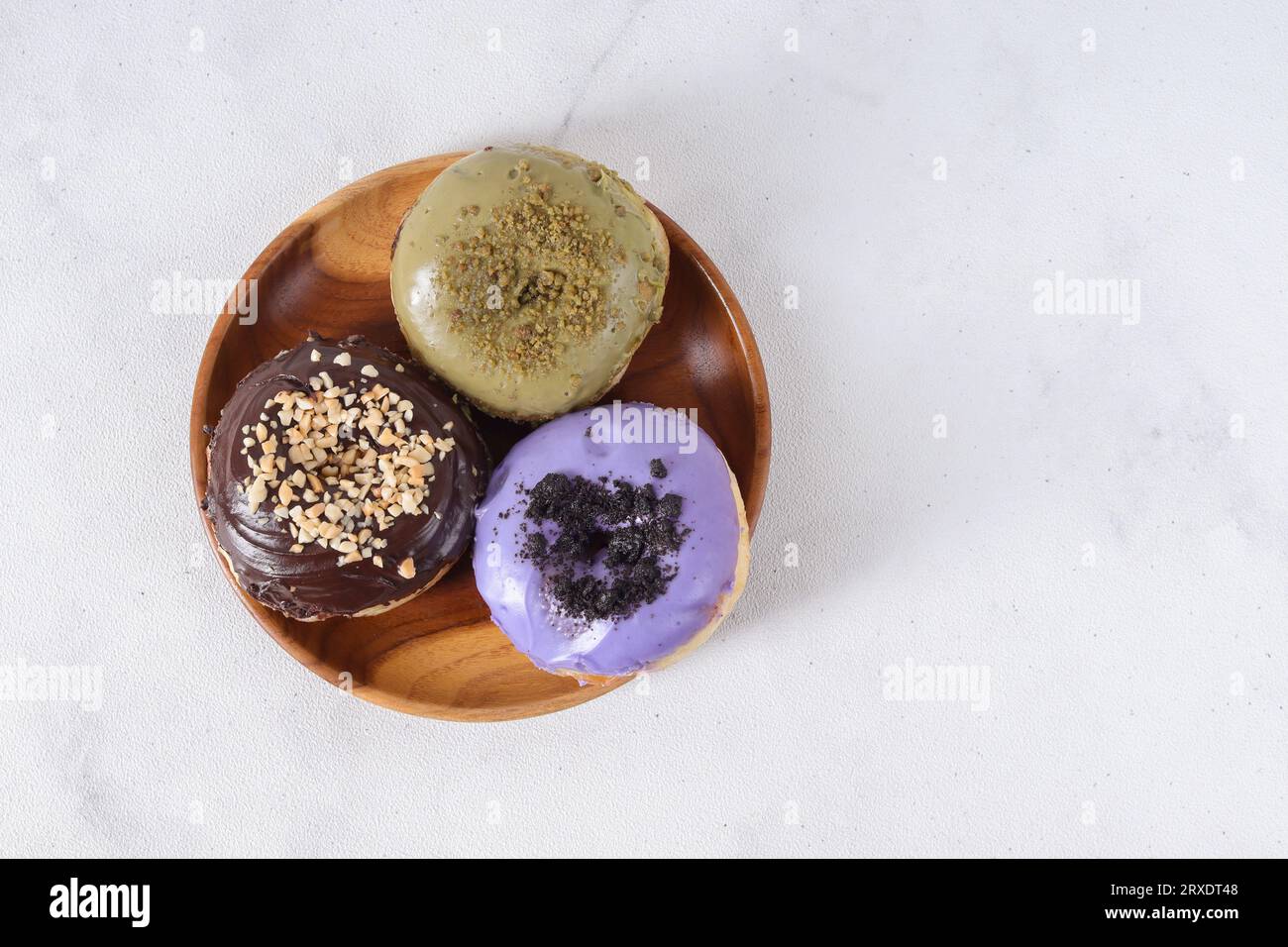 Flat lay top view of delicious sweet donuts with different flavors ...