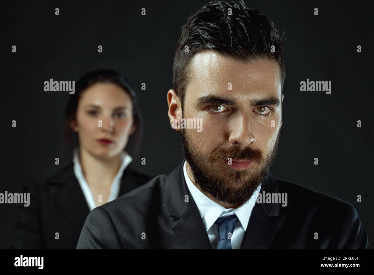 intense man and potentially stronger woman as officials, illustrating the importance of deciding alliance or opposition in achieving victory Stock Photo