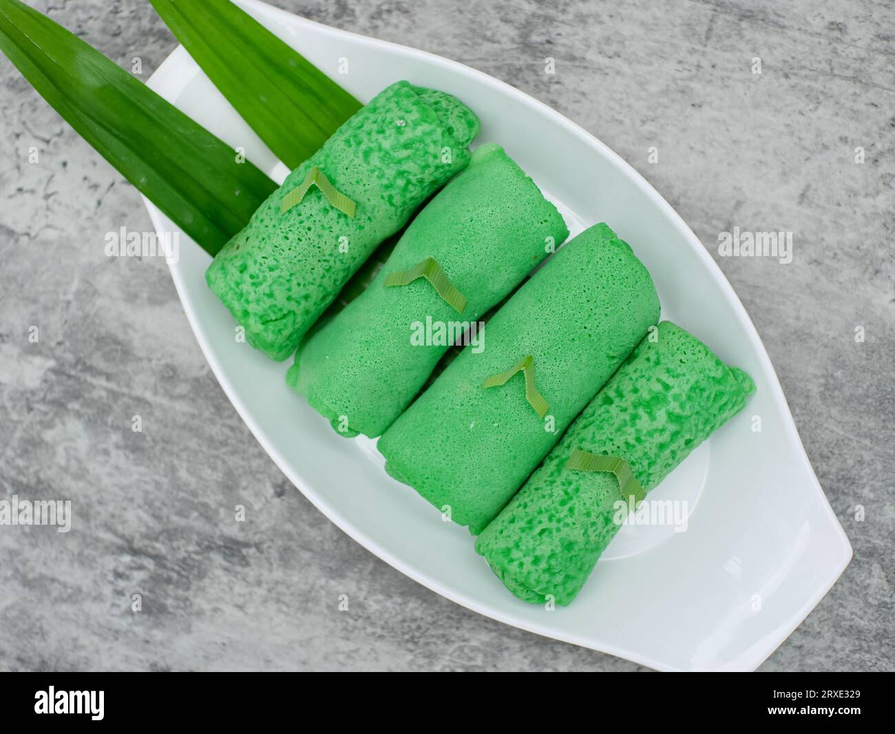 dadar gulung or sweet coconut pancakes from Indonesia, made from flour with grated coconut mixed with palm sugar Stock Photo