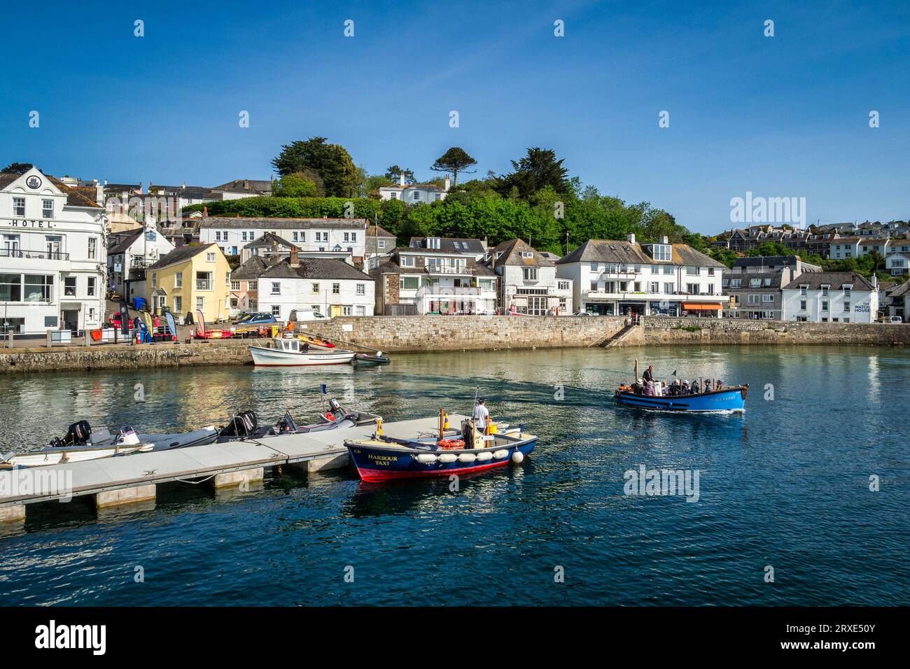 24 May 2023: St Mawes, Cornwall, UK - The harbour of St Mawes on the Roseland Peninsula, with the Place ferry departing. Stock Photo