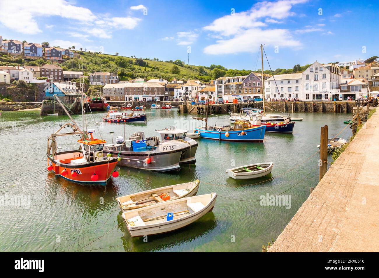 25 May 2023: Mevagissey, Roseland Peninsula, Cornwall, UK - The harbour at Mevagissey on a beautiful summer day during the 2023 heatwave, with boats... Stock Photo