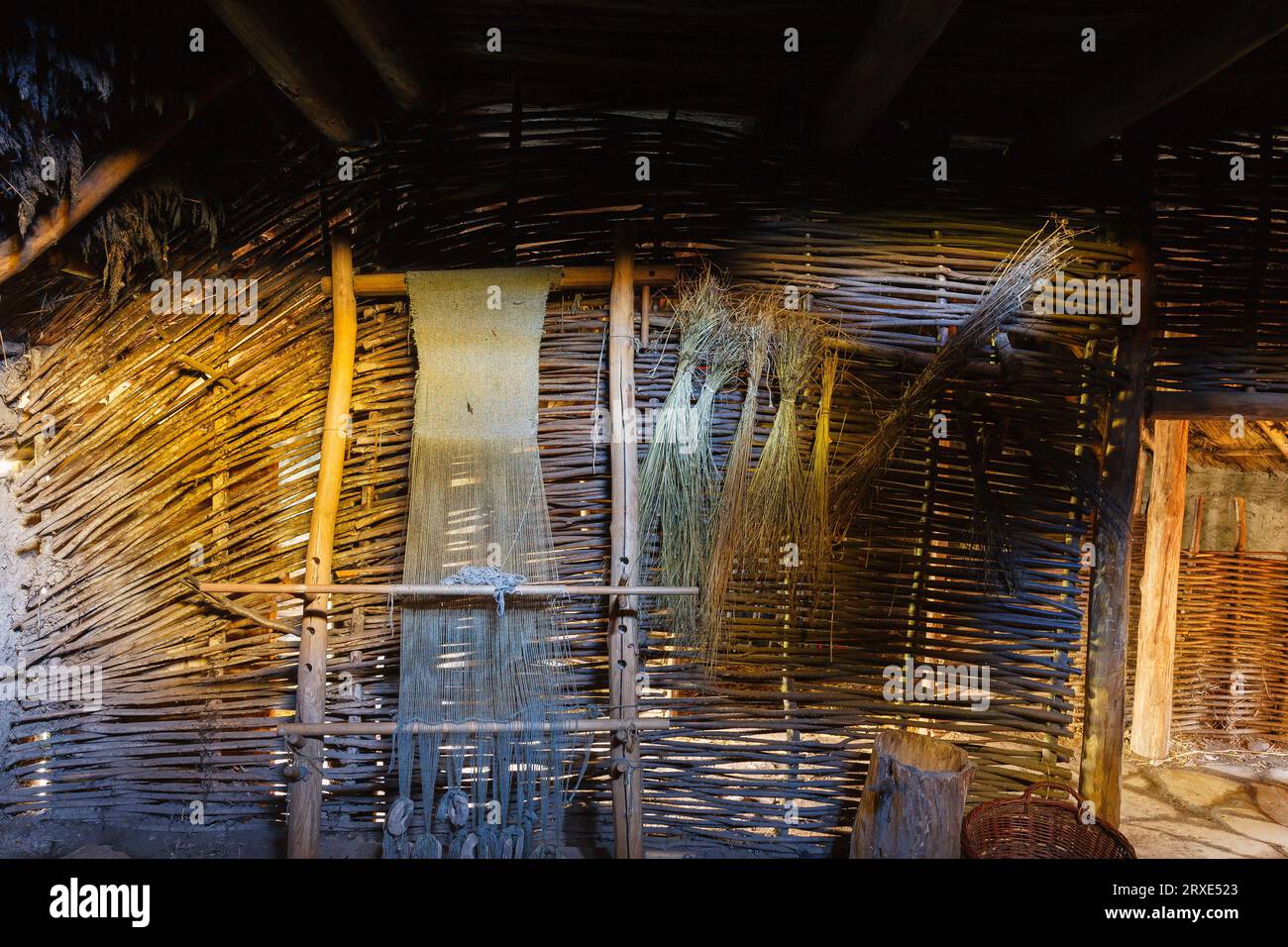 Ancient loom in an old longhouse Stock Photo