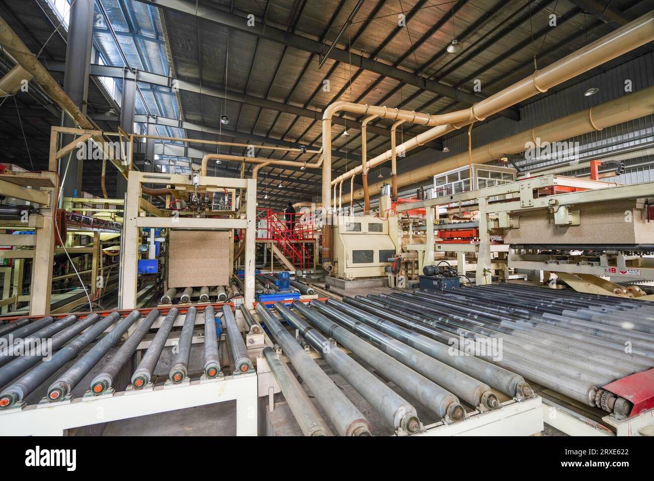 Plate processing machinery and equipment are located in a factory in ...