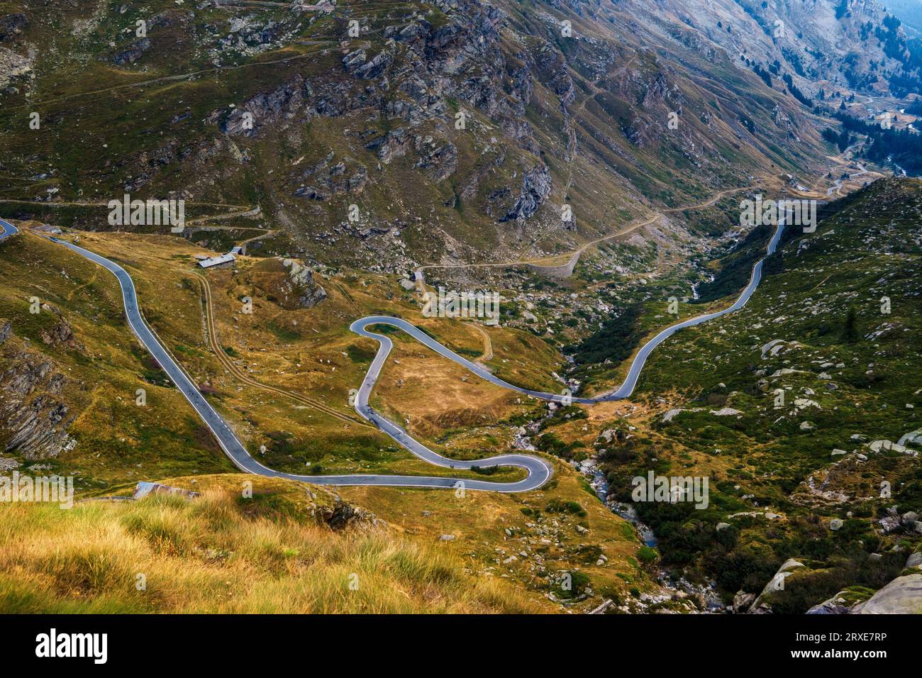 Aerial view of the alpine serpentine road in the valley in the mountains of Gran Paradiso National Park, Italy. Stock Photo