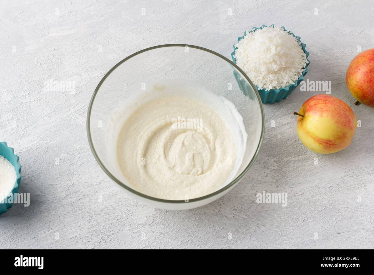 Cooking coconut semolina mannik with apples, do it yourself, step by step, step 1. Mix semolina with yogurt. Stock Photo