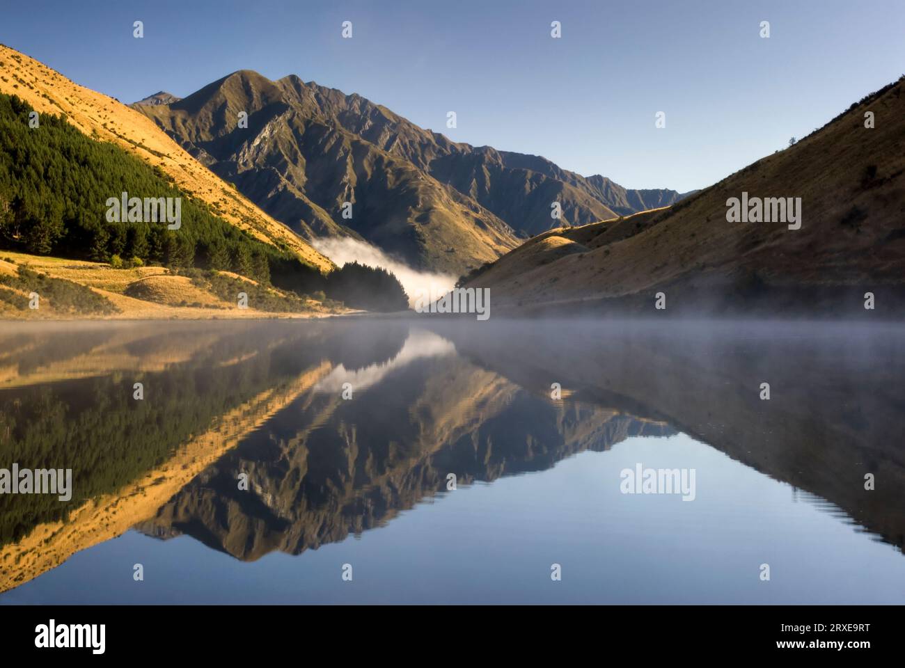 Perfect reflection on Kirkpatrick Lake just before Moke Lake, Queenstown, South Island, New Zealand Stock Photo