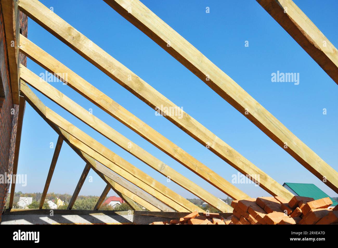 Roofing wooden frame house construction with roof beams, trusses