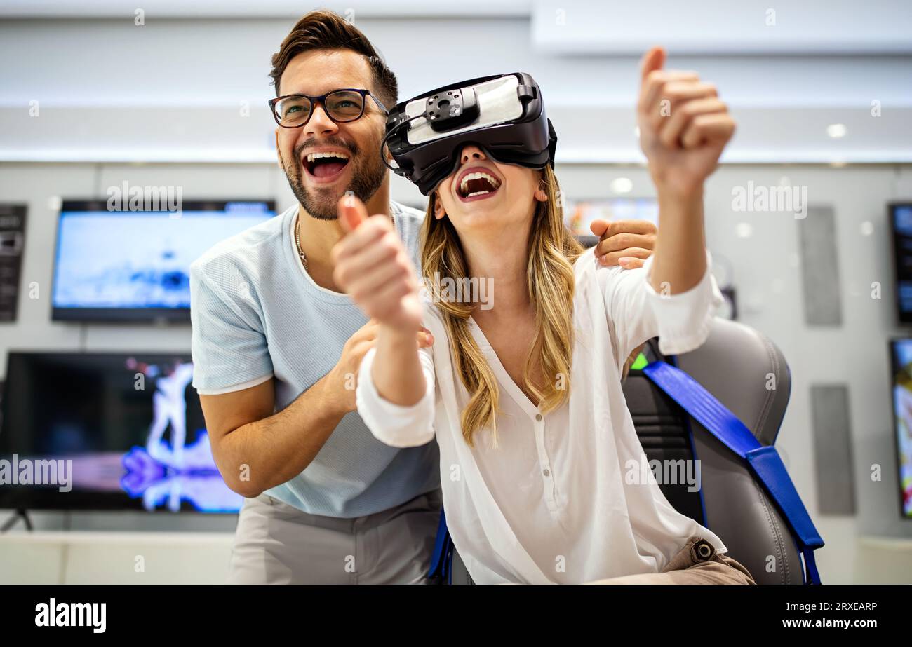 Young people using virtual reality headset. VR, future, gadgets, technology, video game concept Stock Photo