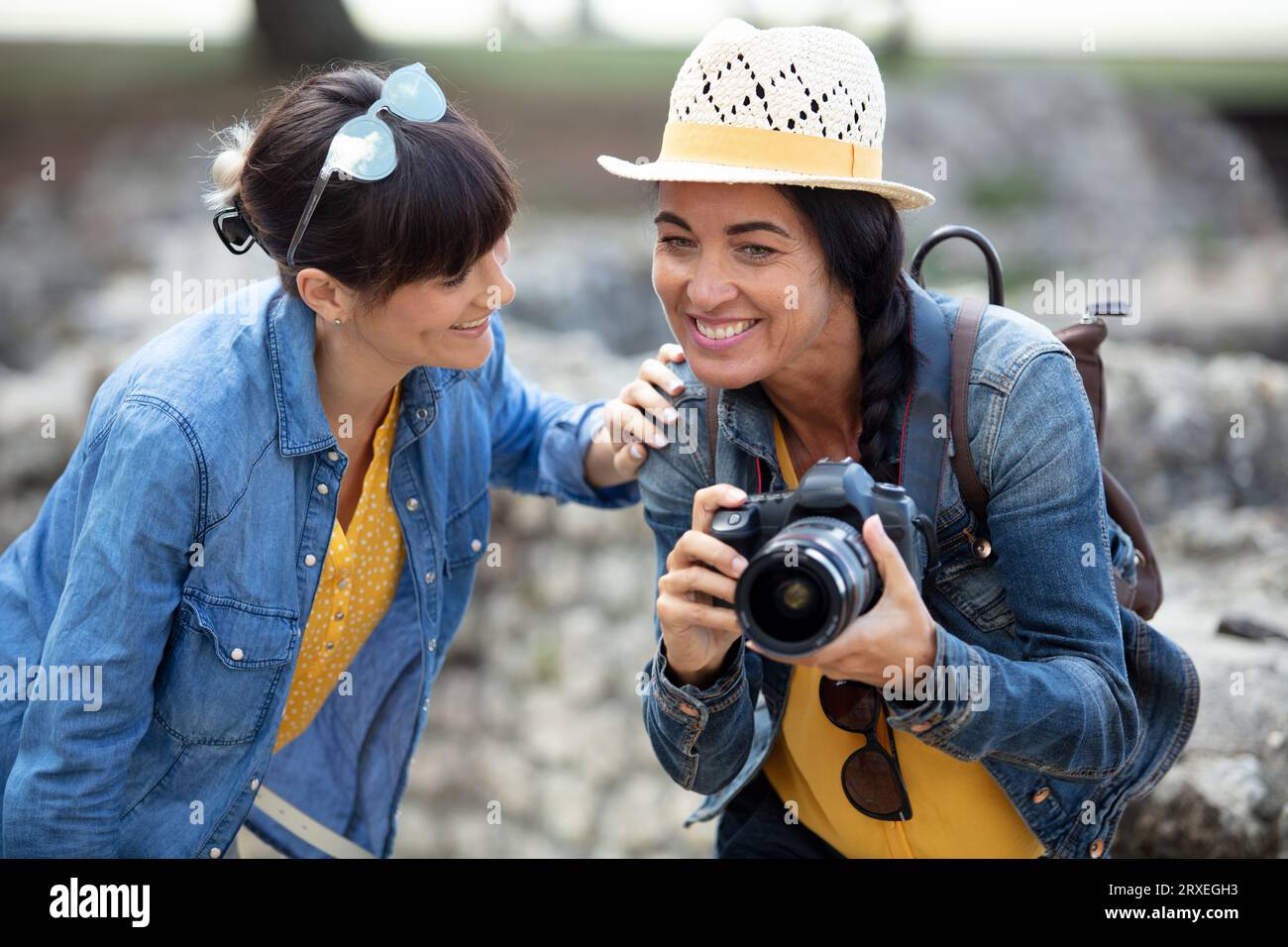 two hikers taking a pictures with camera Stock Photo - Alamy
