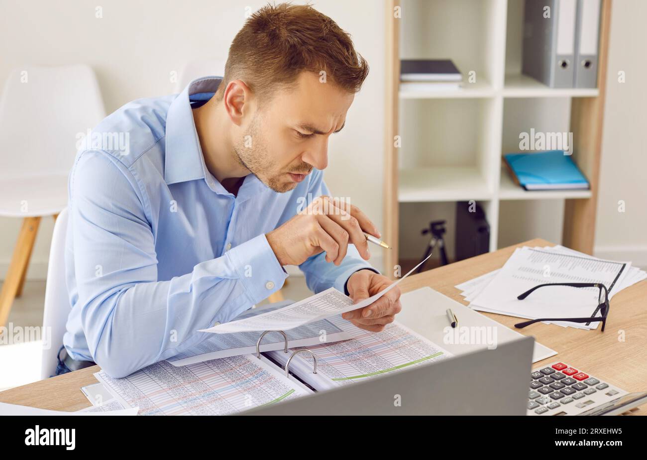 Male accountant holding pen hi-res stock photography and images - Alamy