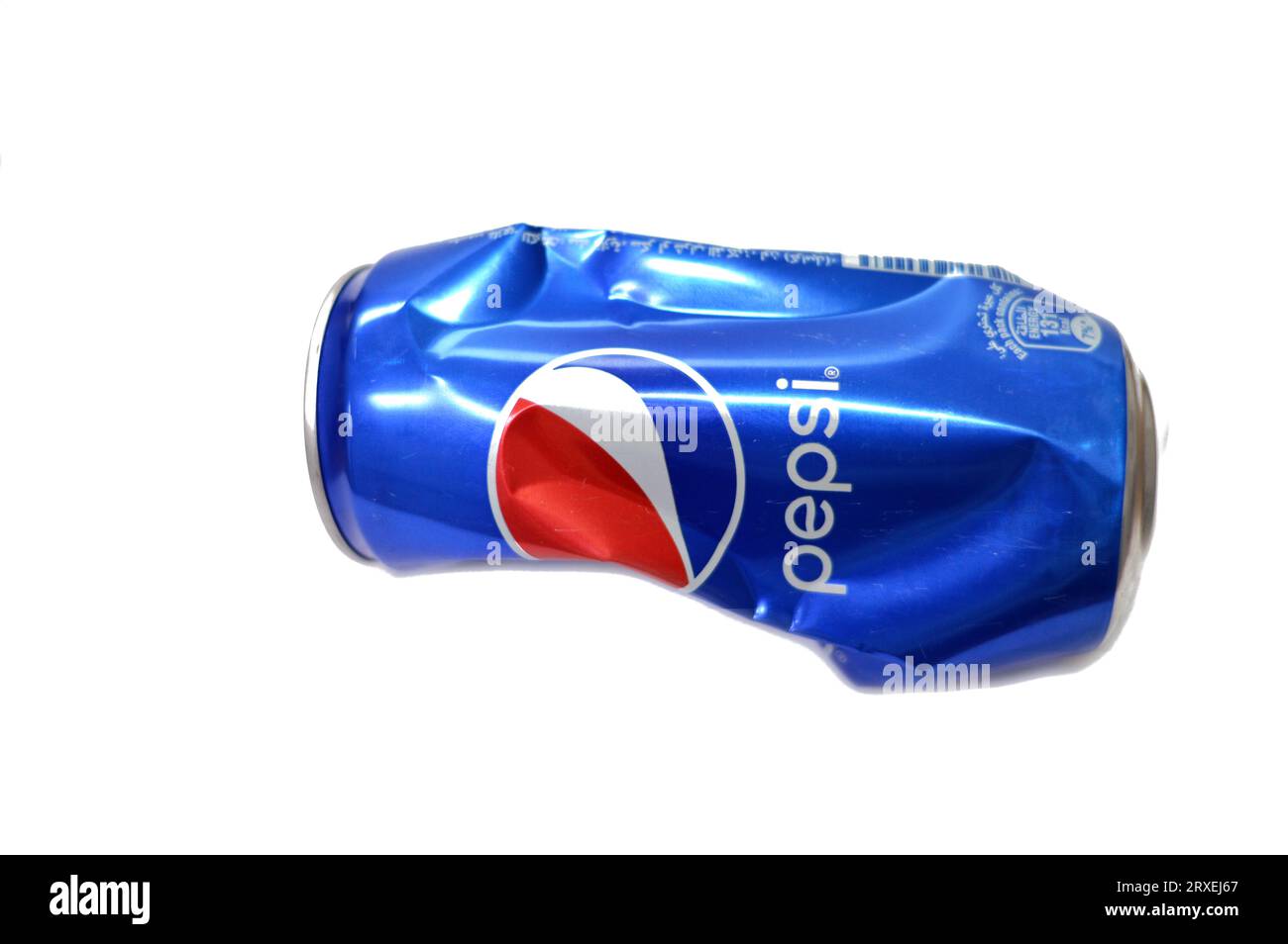 Cairo, Egypt, September 19 2023: Crushed dented Pepsi can, Cola flavor bottle, a carbonated soft drink manufactured by PepsiCo. Originally created, de Stock Photo