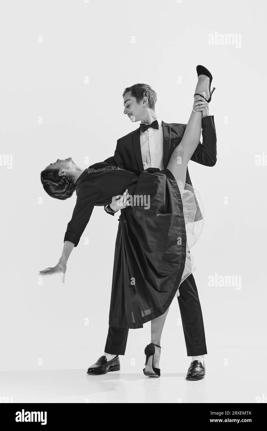 Elegance and passion. Black and white. Attractive young woman and handsome man dancing lindy hop. Stock Photo