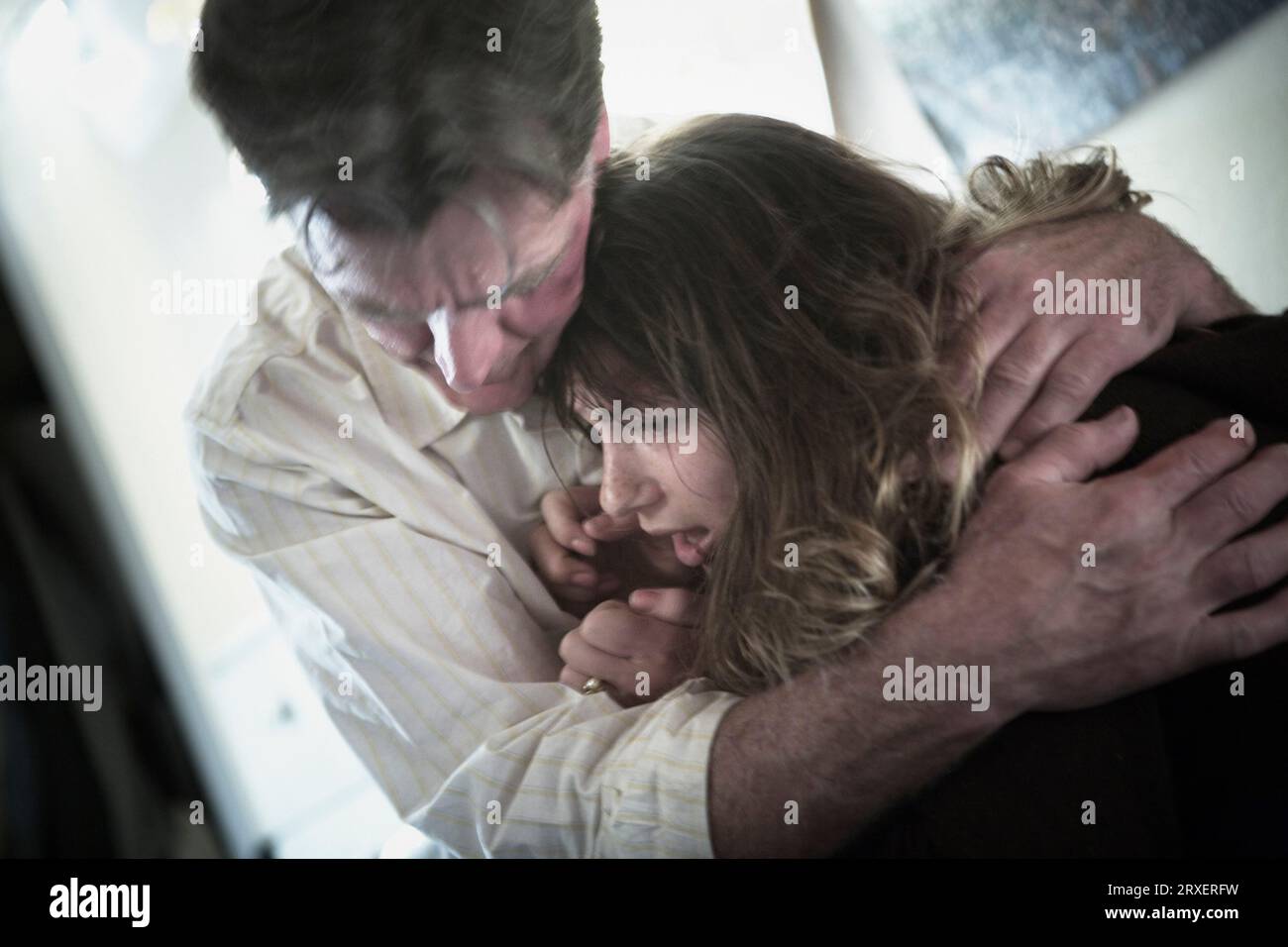 A man holding a young woman. Stock Photo