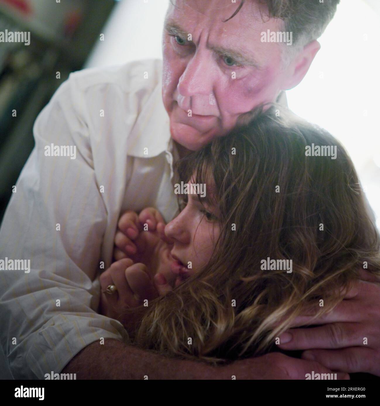 A man holding a young woman. Stock Photo