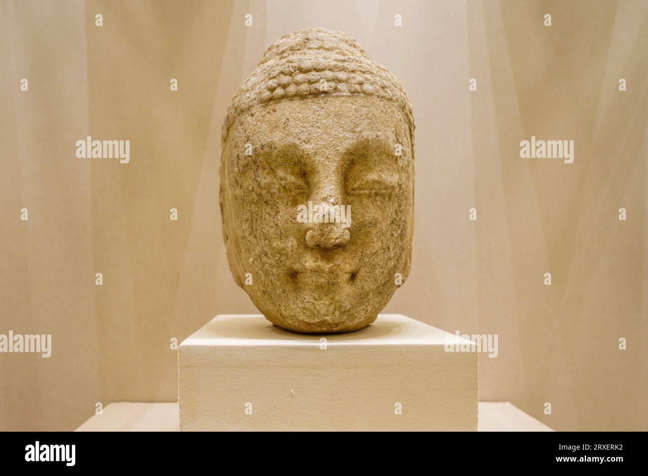 Beijing China, February 16, 2023: Tang Dynasty Stone Carved Buddha Head Statue in the National Museum of China. Stock Photo