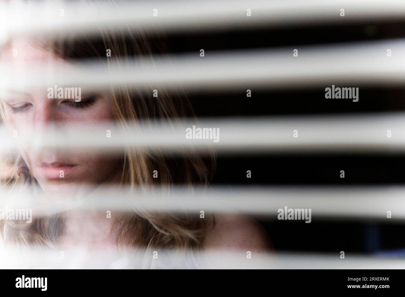 Open Blind Reference Portrait of a young woman as seen through open blinds Stock Photo - Alamy