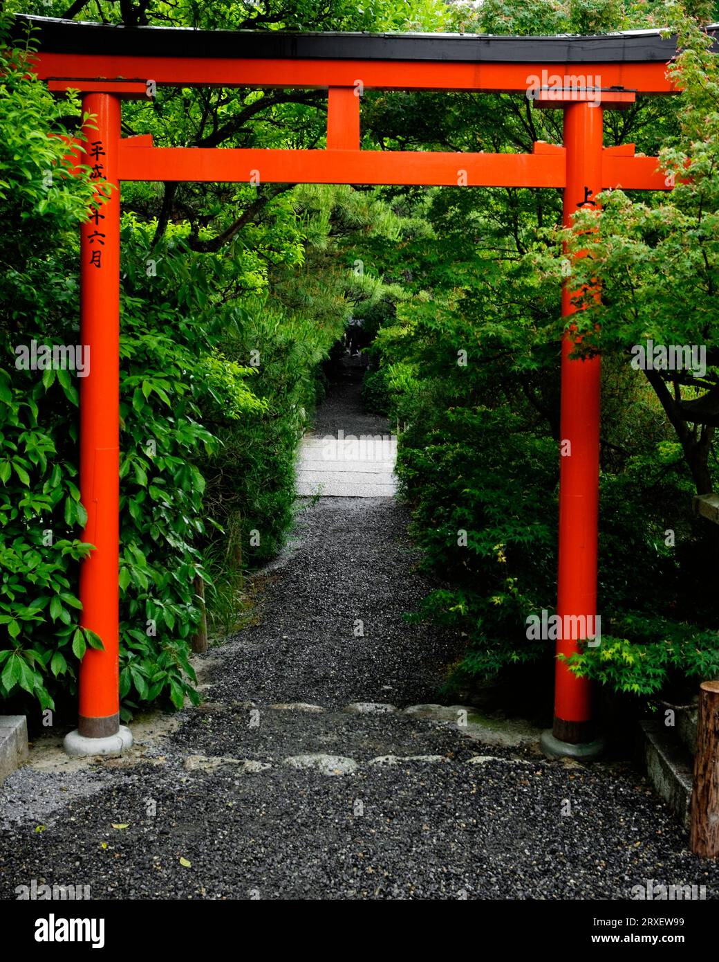 A vermilion colored torii; a traditional Japanese gate Stock Photo Alamy