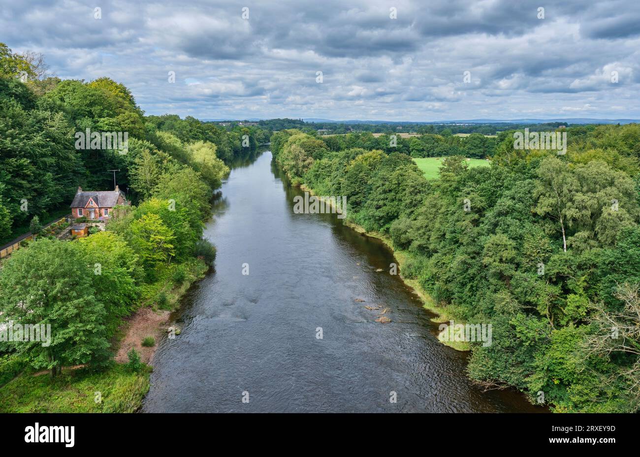 Looking north along the River Eden from the Corby Bridge railway and footpath crossing at Wetheral, near Carlisle, Cumbria Stock Photo
