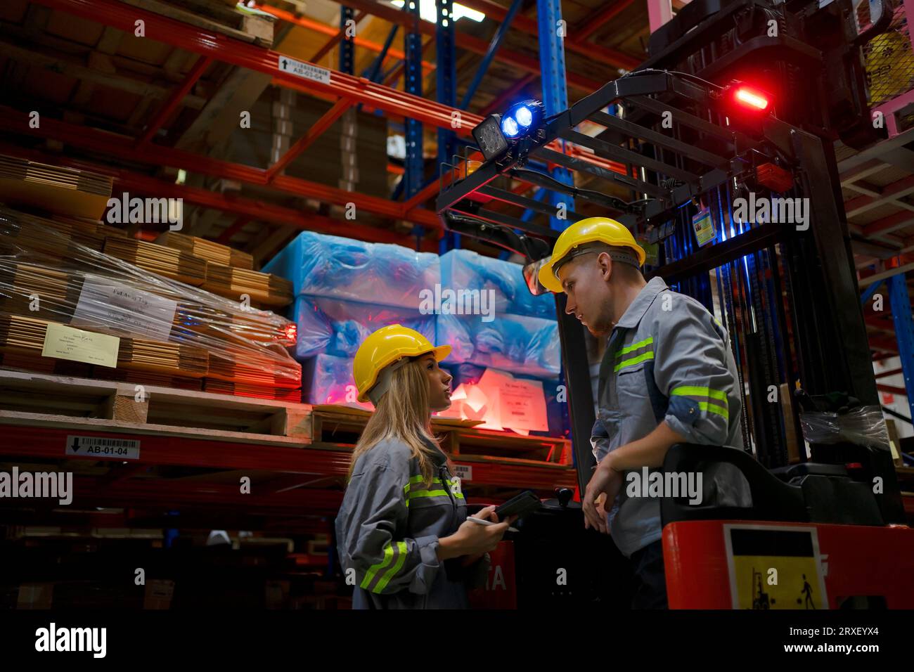 Blue collar worker and cardboard package factory blue collar worker