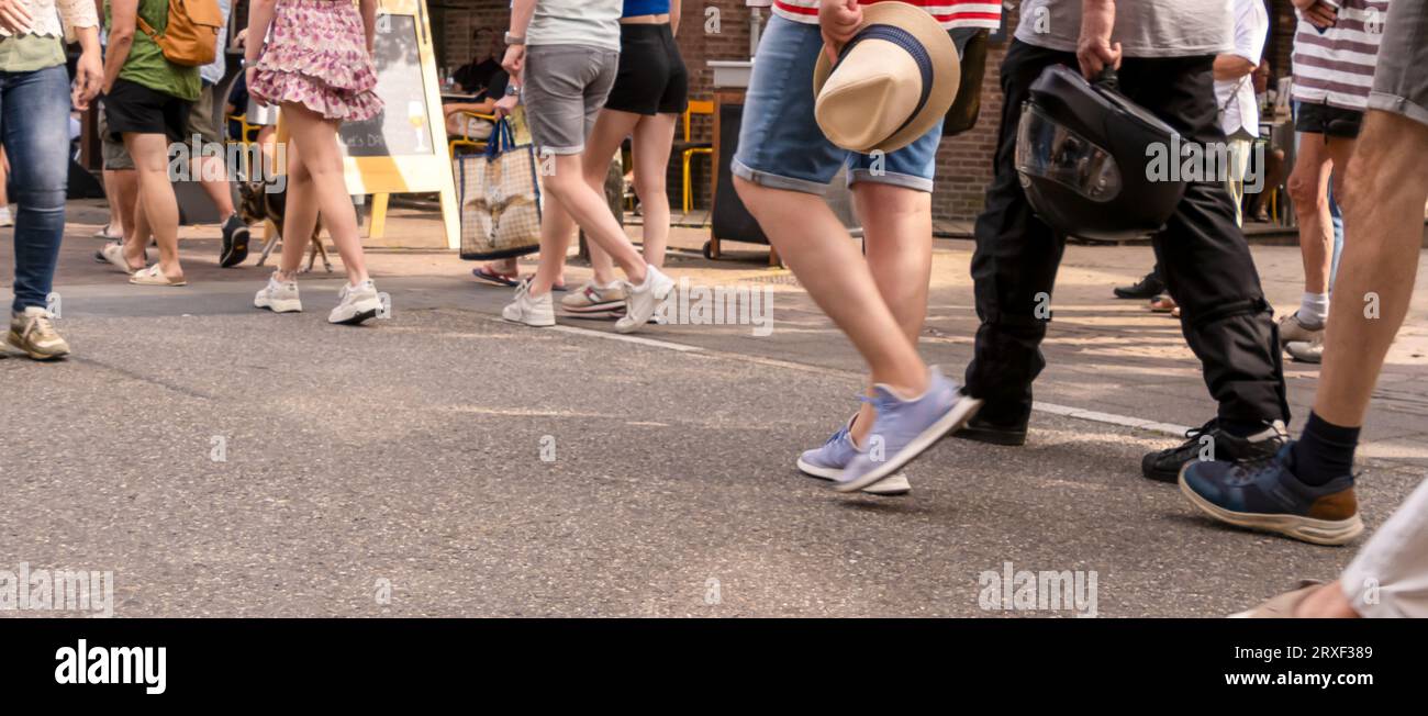 Pedestrians walking along in a pedestrian area in summertime Stock ...