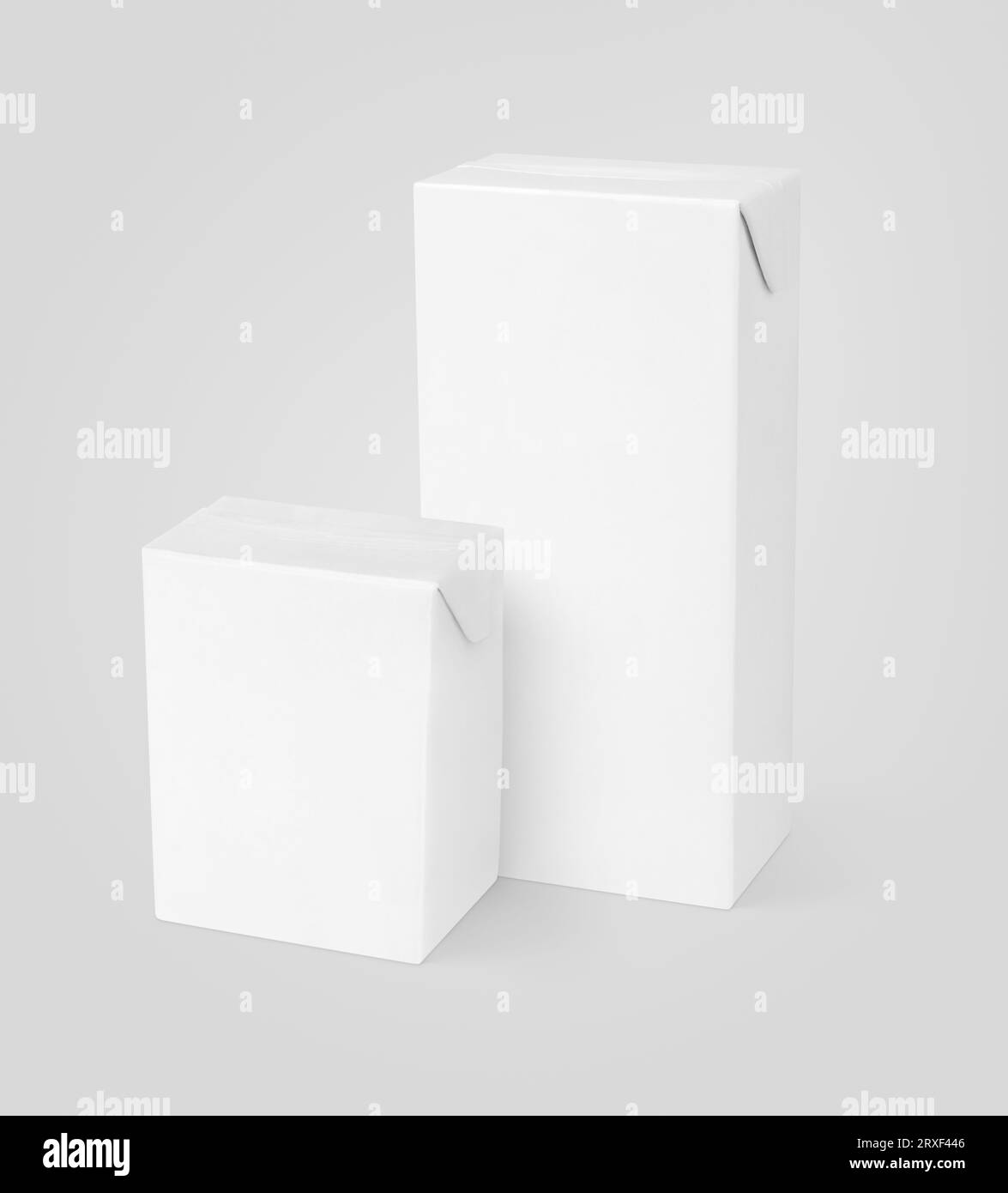 Group of different milk or juice carton packages on gray background
