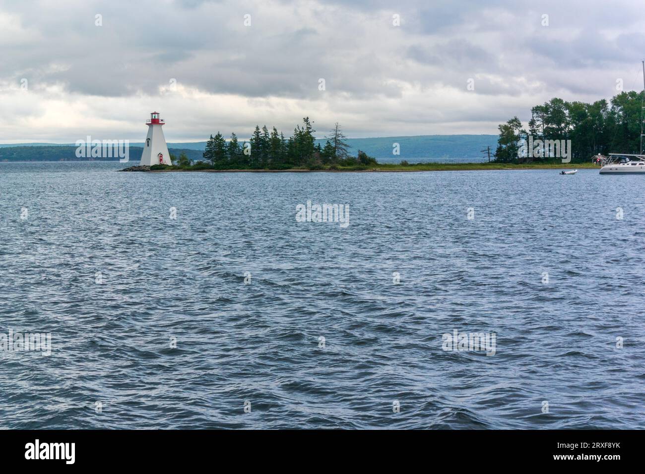 View of a lighthouse on an island against sky Stock Photo