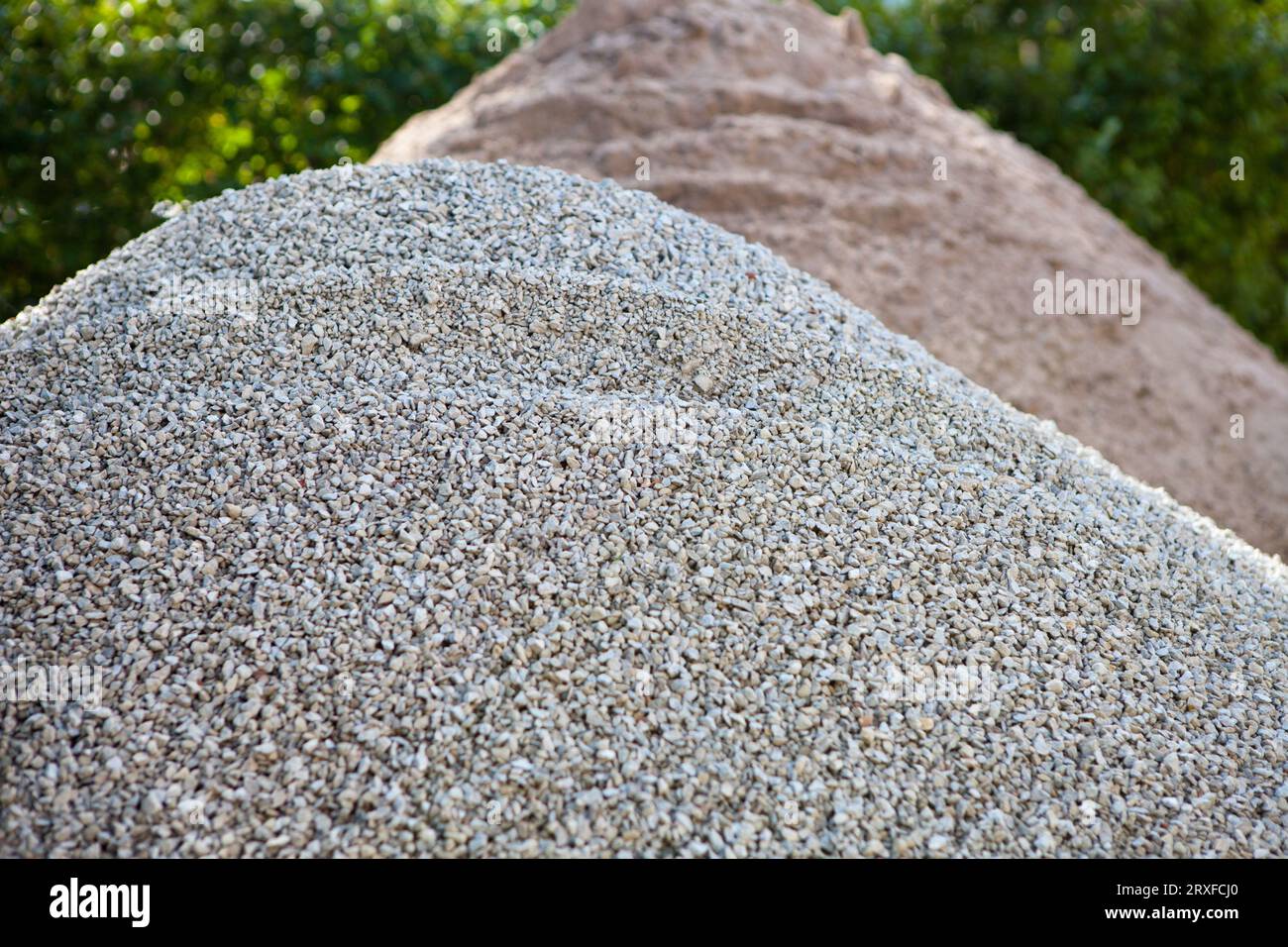 construction materials pile or hill. Stone and sand background. gravel and macadam. Industrial fraction Crushed gray Stock Photo