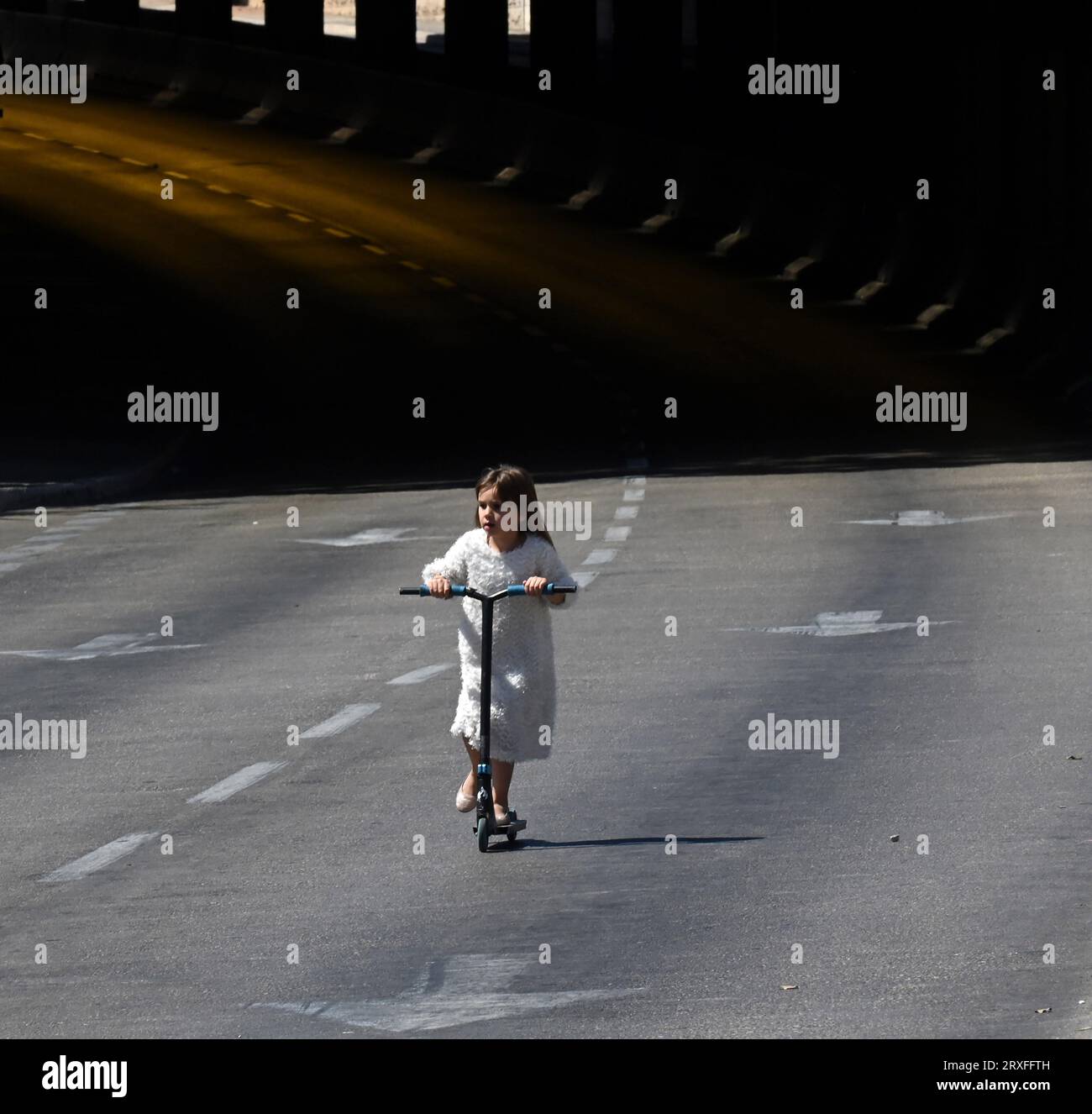 Jerusalem, Israel. 25th Sep, 2023. An Israeli girl rides a scooter on a
