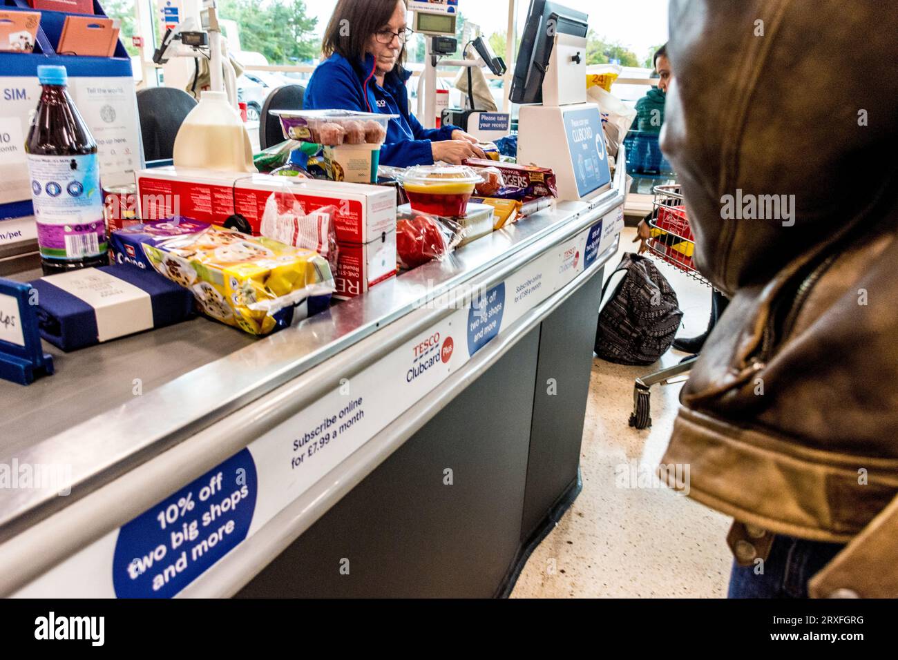 Customer checkout at Tesco supermarket, County Antrim, Northern Ireland. Stock Photo