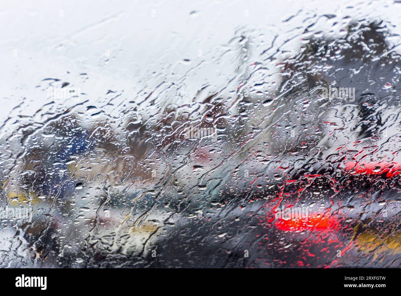 Rain in traffic looking through car windscreen, Northern Ireland Stock Photo
