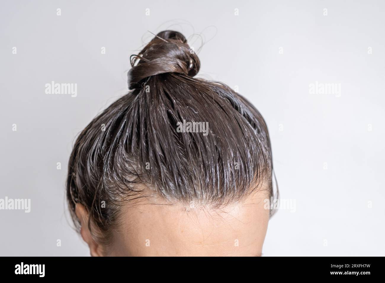 Close-up of a woman's head in the process of hair coloring  Stock Photo